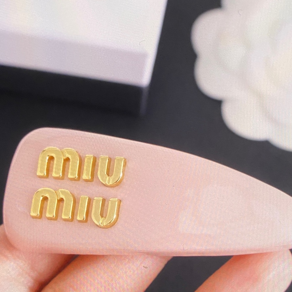 Miu Miu Pink Hair Clip with Gold Accents